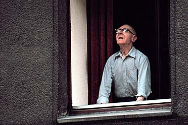 About God and the world - old man looking out of the window