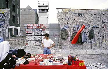 The Berlin Wall in 1990 - GDR clearance sales have started