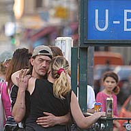 couple in front of berlin u-bahn sign